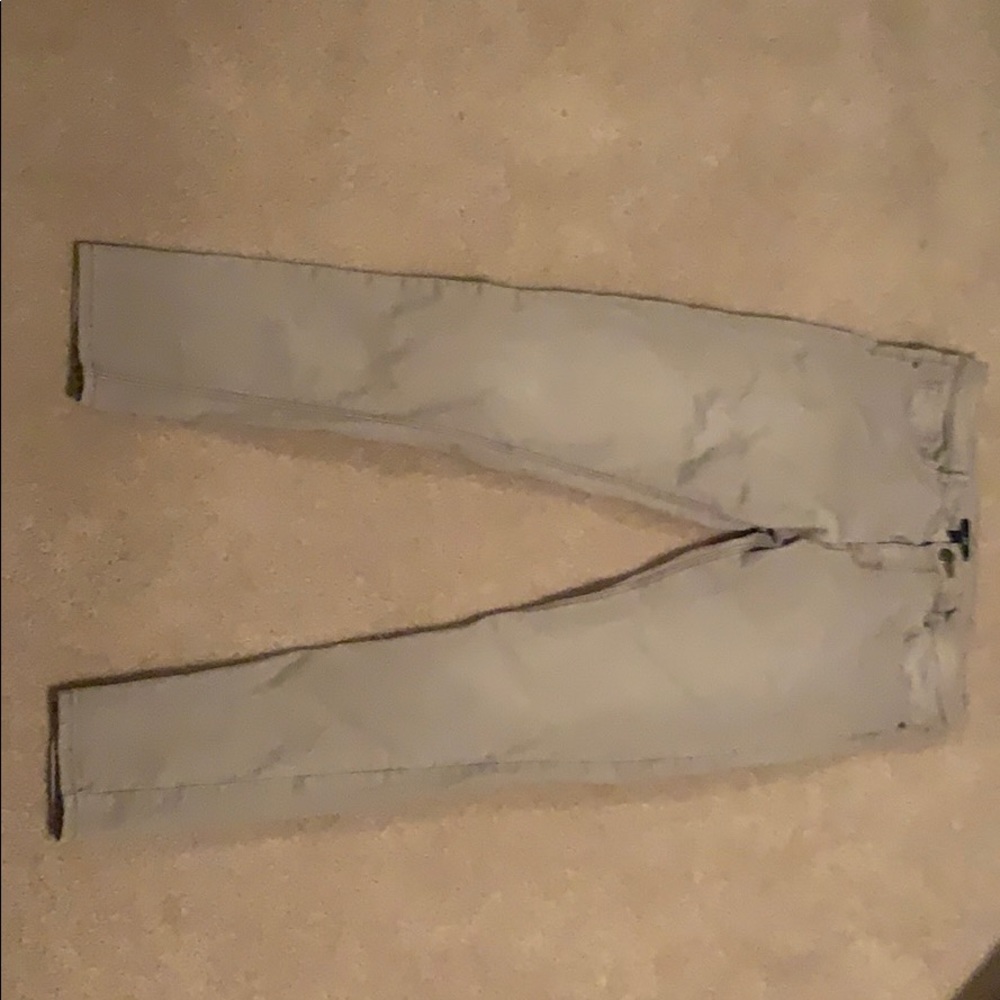 A tan pair of skinny jeans.